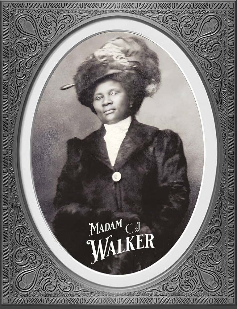 A framed black-and-white portrait of Madam C.J. Walker in an ornate oval surround, her name lettered beneath.