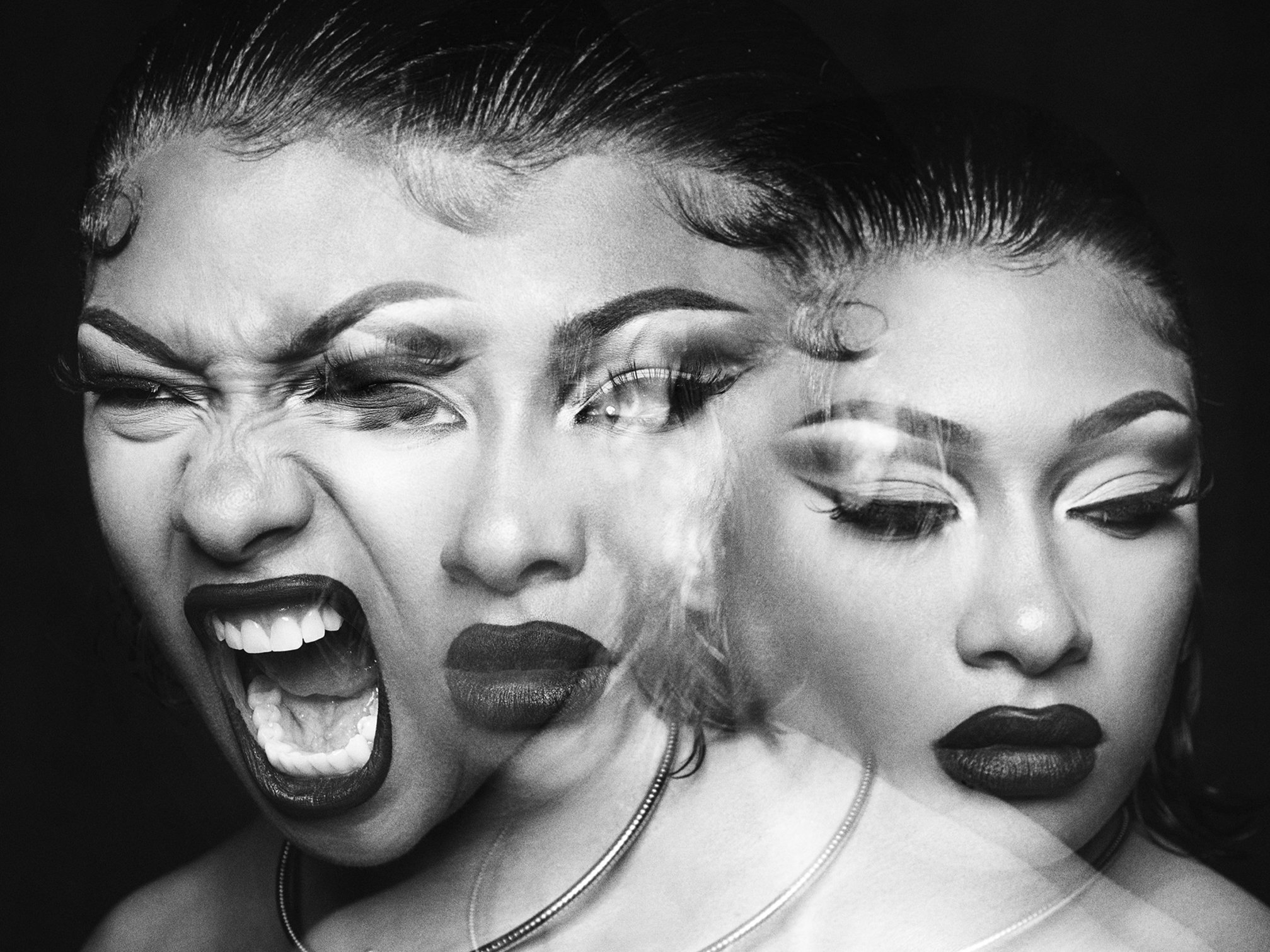 A black-and-white multiple-exposure portrait of Megan Thee Stallion, three overlapping expressions blurred together.